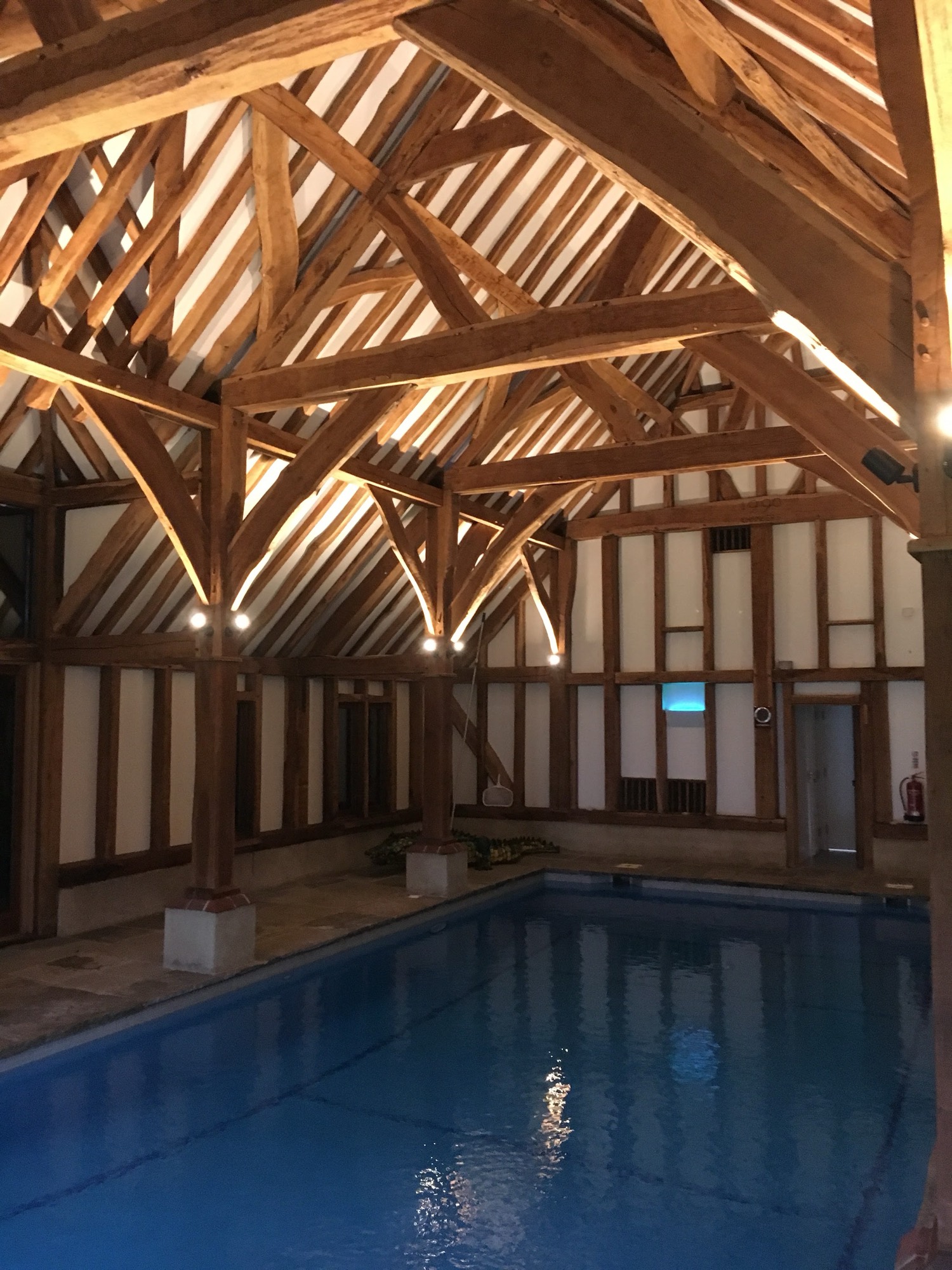 Pool barn, lit into the trusses
